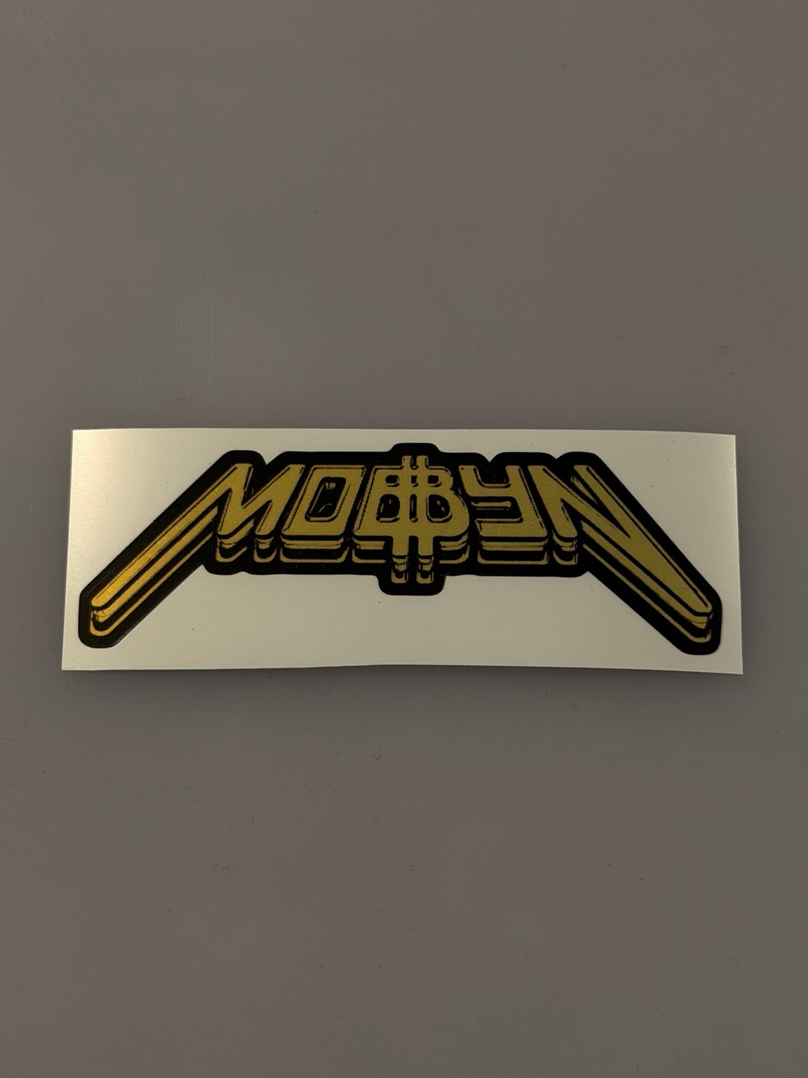 Złota glossy wlepa MOBBYN 1 szt.