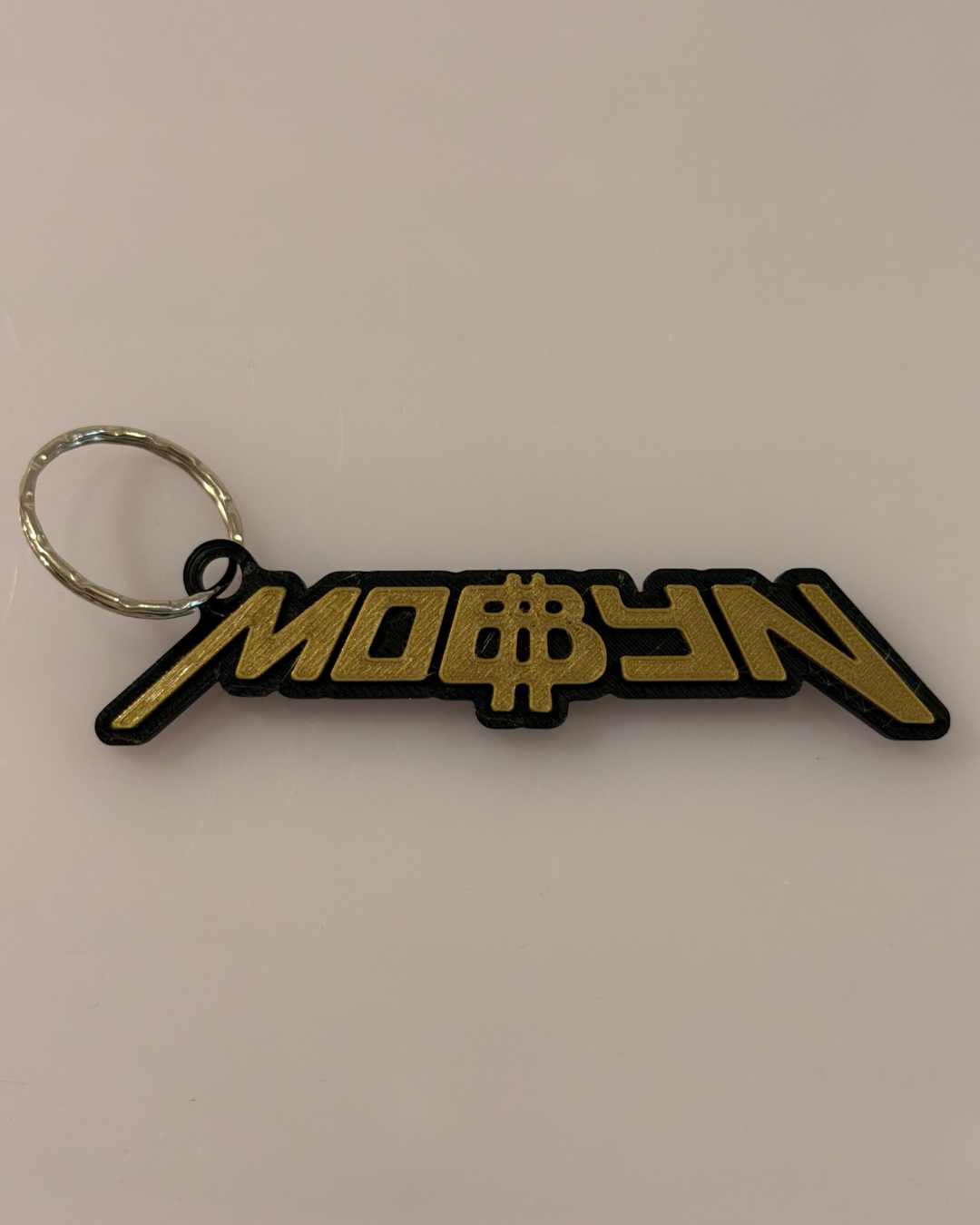 Brelok 3D MOBBYN czarno-złoty